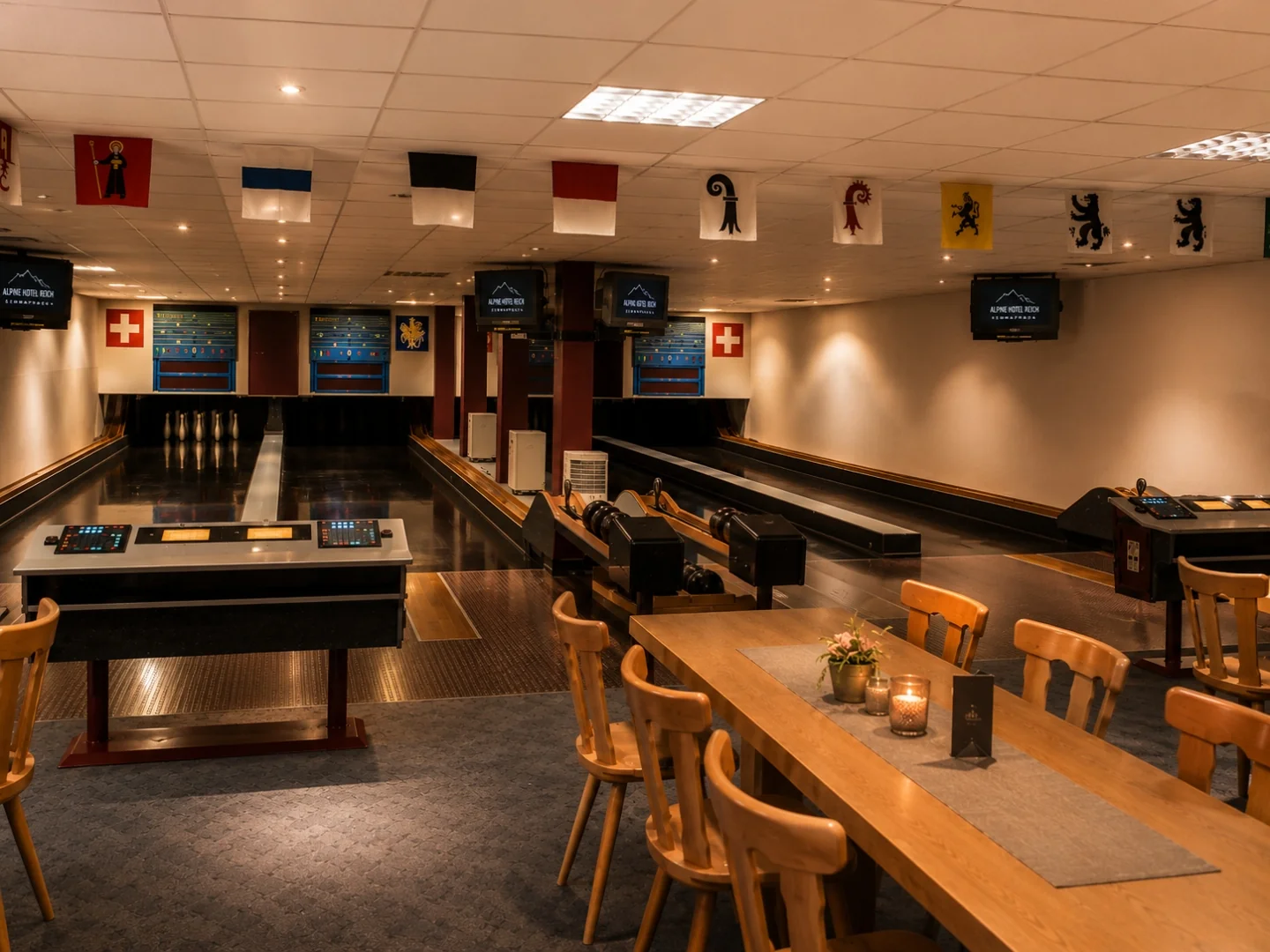 Authentic Kegelbahn at Alpine Hotel Reich — wooden lanes with seating and scoring area